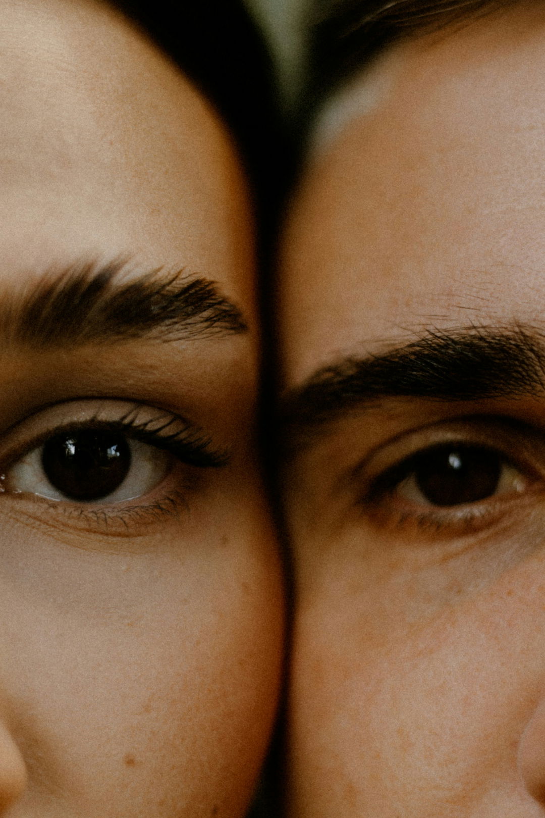 Close-up of two people's eyes